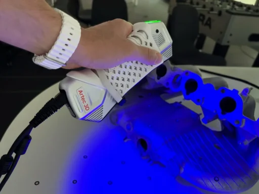 Artec Point laser scanner inspecting a machined part