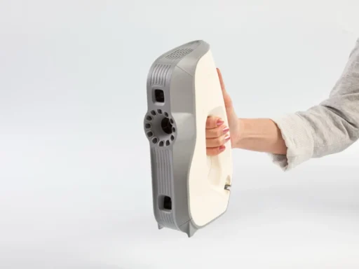 Artec Eva structured-light 3D scanner held in one hand