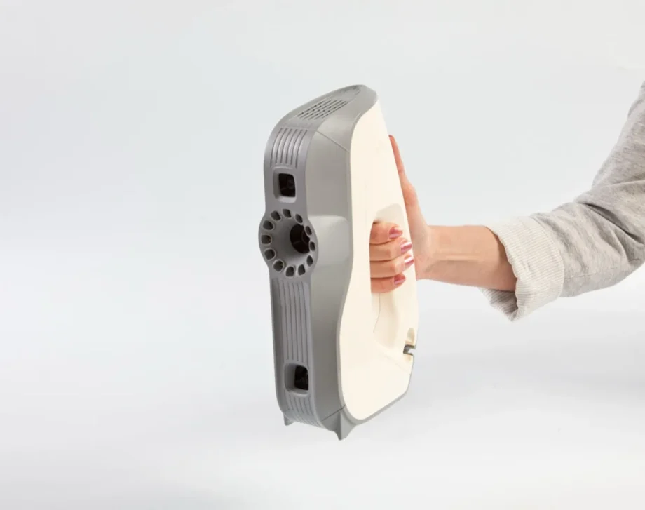 Artec Eva structured-light 3D scanner held in one hand
