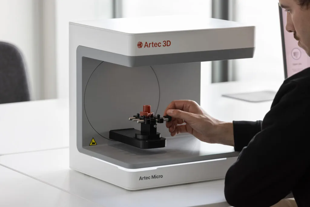 Hand placing a component into the Artec Micro II scan volume