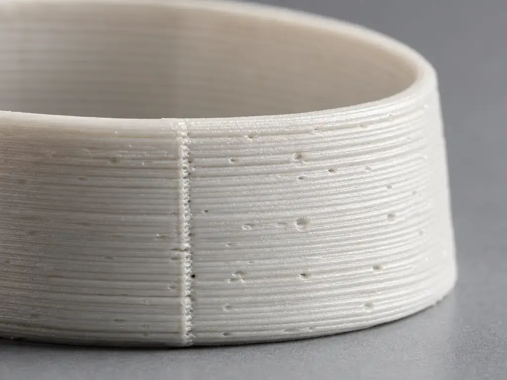 Macro of FDM print layer grooves and seams on a food-contact test part